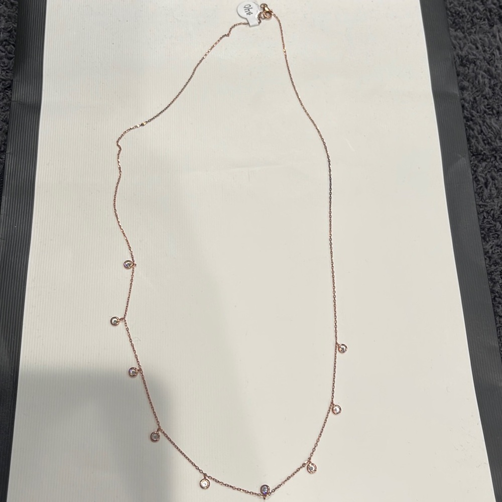 NWT Rose gold necklace with dangling diamonds